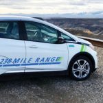 EV car parked overlooking a canyon