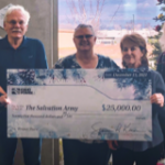 Image of a group of Idaho Power employees presenting a donation check to the Salivation Army