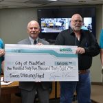 Photo of Idaho Power presenting an incentive check to the City of Blackfoot.