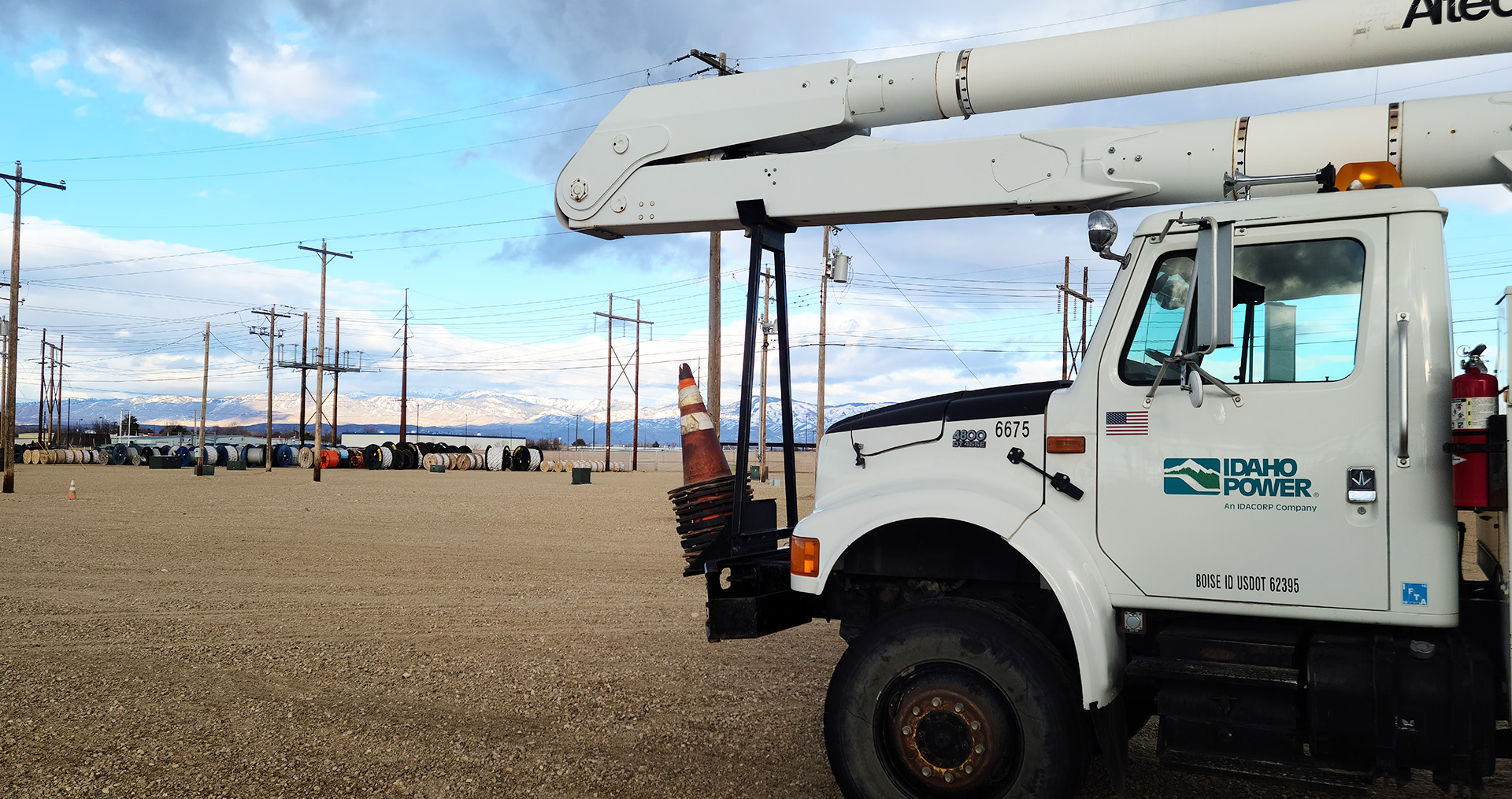 Image of a Idaho Power truck nearby power lines in a training yard