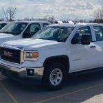 Image of Idaho Power pickups ready for auction.