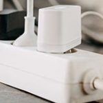 Power strip with items plugged in