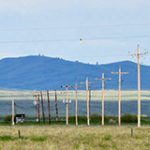 Spring landscape with power poles. Keep safety in mind.