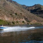 Photo of a boat pulling a water skier in the 'Snake River.