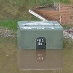 Image of a flooded ground transformer box.