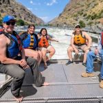 A group of Idaho Power interns and employees on a boat in the Snake River.