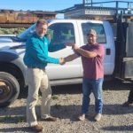 Jim Mason from Idaho Power hands over the keys to a truck donated to the city of Dietrich.