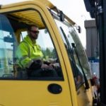 Idaho Power tradesman drives a forklift.