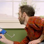 Permalink to Energy Efficiency Guide Delivers Energy-Saving Tips Man in house caulking window