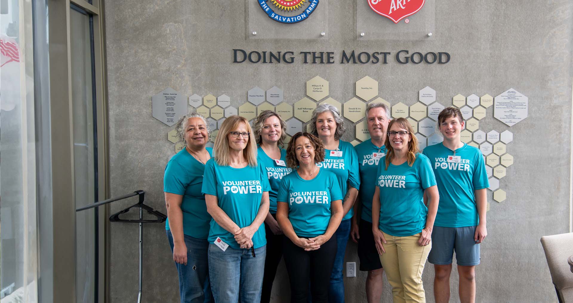 Idaho Power employees volunteering at the Salvation Army and standing for a group photo