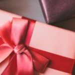 Pictures of holiday gifts wrapped in various shades of red.