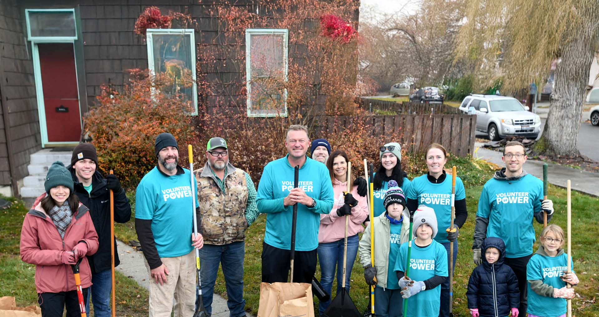 Idaho Power employees and their families raking leaves