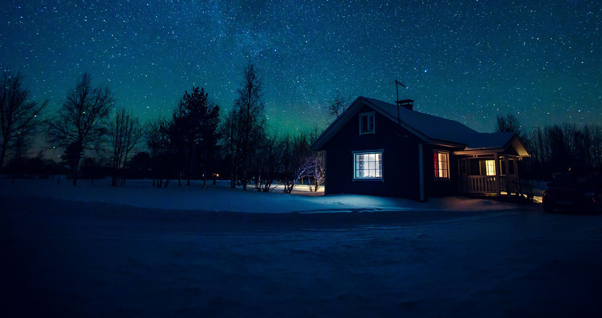 Illustrated house at night in snowy mountains